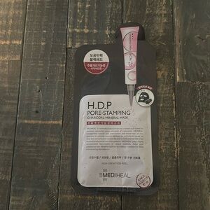 H.D.P. Pore stamping charcoal mineral mask.
